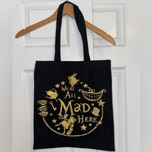 “We’re All Mad Here” Tote Bag | Alice in Wonderland Quote | Black & Gold Graphic